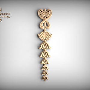 May include: A light-coloured wooden decorative carving featuring a vertical arrangement of symmetrical floral and leaf-like motifs. The design includes a top heart-shaped element followed by a series of downward-pointing petals. The text Wonderful Carving is visible in the top left corner.