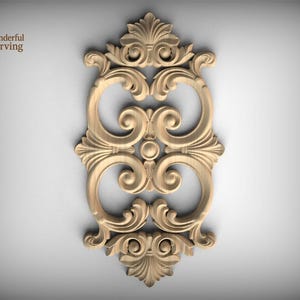 May include: A light-colored wooden decorative carving featuring symmetrical scrollwork, acanthus leaf motifs, and a central circular element. The design includes the text Wonderful Carving in the upper left corner with a leaf graphic icon.