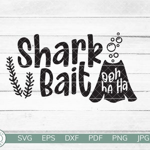 May include: Black and white graphic design with the text "Shark Bait" and a cartoon shark with the text "ooh ha ha" in a speech bubble.