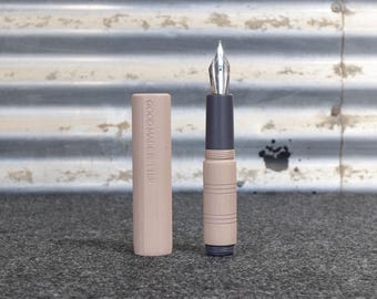 Jester Fountain Pen: A pocket sized artisan ebonite pen with hand carved texturing