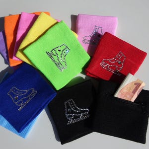 May include: Assortment of colourful wristbands with a sparkly ice skate design. Some wristbands have a zipped pocket.