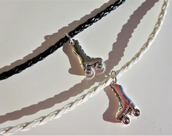 May include: Two braided leather necklaces with roller skate charms. One necklace is black and the other is white.