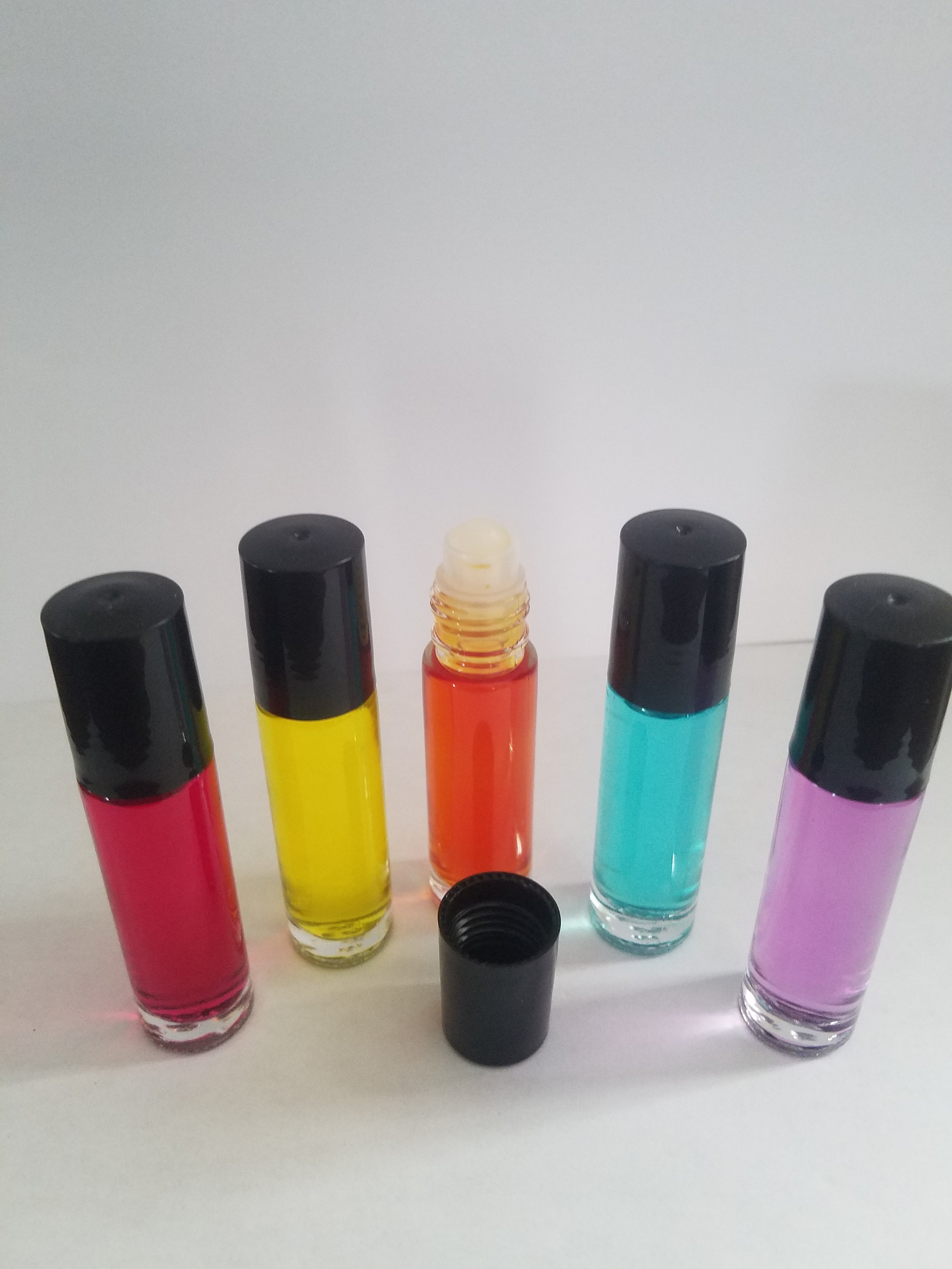 Perfume rollerball. Price is for all 5. 1 of each flavor. You Etsy