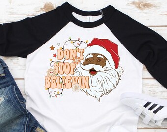 Don't Stop Believing Kids Tee,Christmas Toddler Shirt, Holiday Kids Shirt,Retro Cute Vintage Christmas,Black Santa Shirt,Christmas T-Shirt