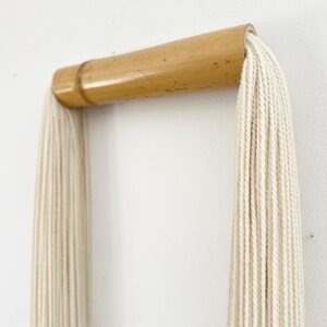 Luxury neutral wall hanging in modern interior, bamboo and cotton fiber art for elegant home styling