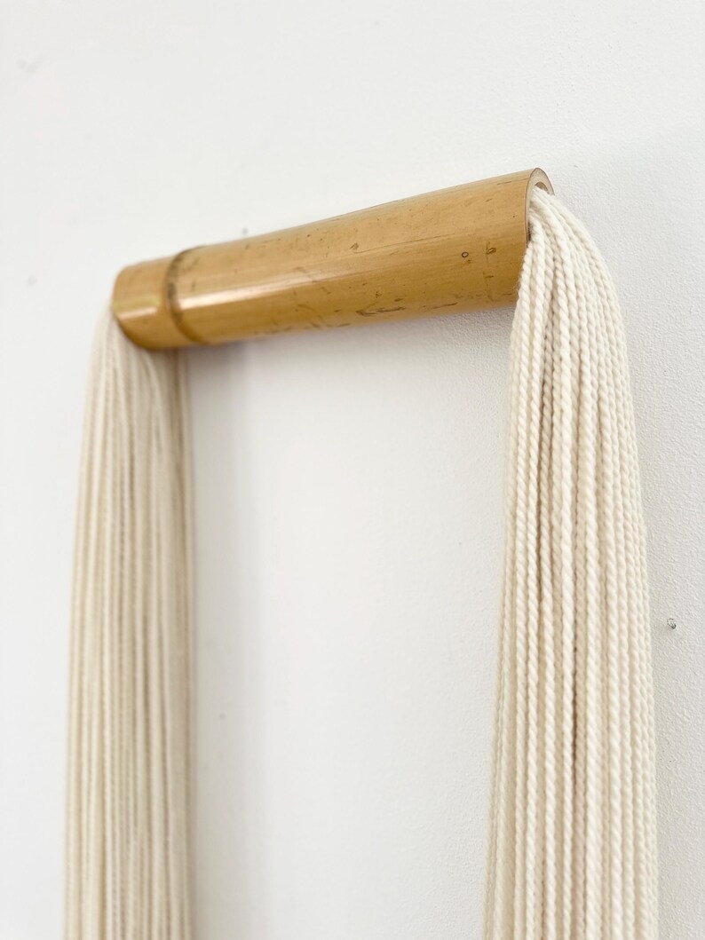 Luxury neutral wall hanging in modern interior, bamboo and cotton fiber art for elegant home styling