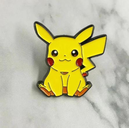 pokemon pikachu with butterflies and a scarf sitting on the ground