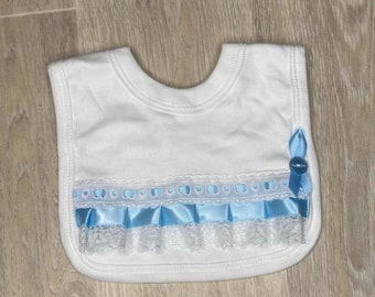 Fancy detail bib with blue ribbon