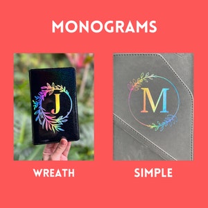 May include: Two black leather journals with different monogram styles. The first journal has a rainbow wreath with the letter "J" in the center. The second journal has a simple rainbow letter "M" in a circle.