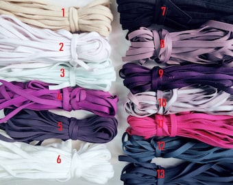 Puede incluir: Trece colores diferentes de cordón elástico, cada color está numerado del 1 al 13. El cordón tiene aproximadamente 1,2 cm de ancho.