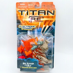 May include: A Titan A.E. Arc Runner and Cale action figure in its original packaging. The figure is a futuristic design with a light green and tan color scheme. The packaging features the text "ELECTRONIC POWER" and "PULSATING BATTLE LIGHT!"