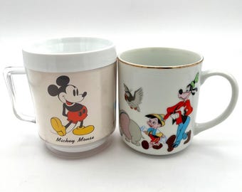 2 Vintage Walt Disney Mickey Mouse Coffee Mugs Donald Pluto Dumbo Goofy Jiminy