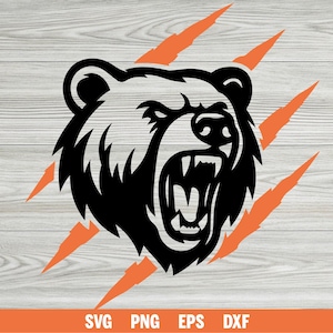 May include: A black and white bear head graphic with an open mouth and visible teeth, set against orange claw marks. The bear graphic is on a light gray wood grain background. The bottom of the image includes the text "SVG PNG EPS DXF".