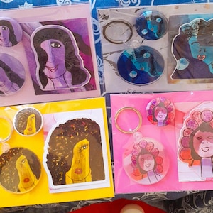 Artwork Variety Pack Include: Matt Sticker, Button Pin and Keychain