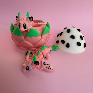 Mini jouet sensoriel flexible fruit du dragon et oeuf agité