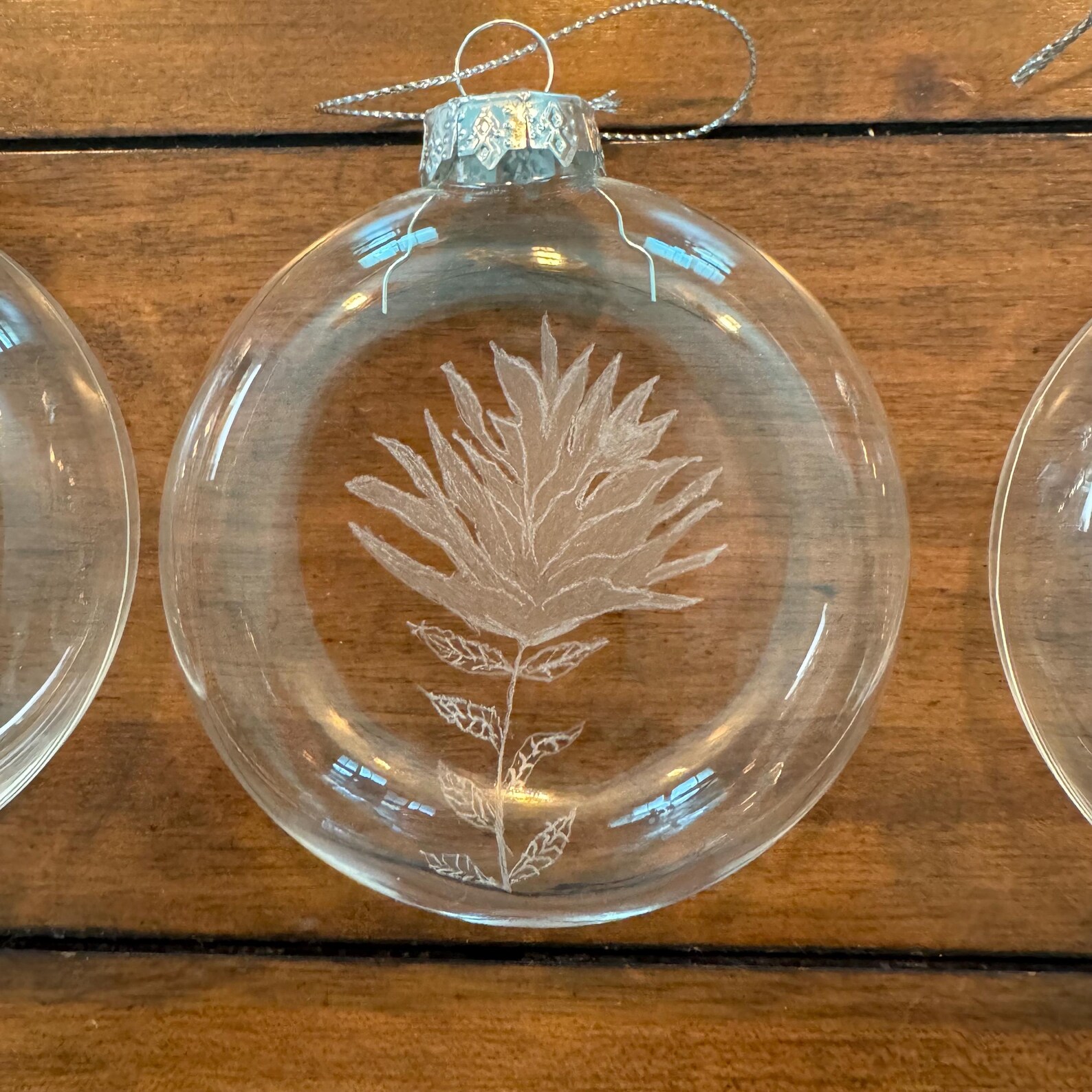 Round Glass Christmas Ornament With Native American Paint Brush Flower