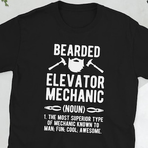 May include: Black t-shirt with white text that reads "Bearded Elevator Mechanic (Noun)" and "The most superior type of mechanic known to man; Fun; Cool; Awesome."