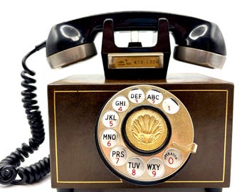 MTA concept rotary phone (c. 1967) art deco leather wrapped body with brass shell motif vintage working telephone.