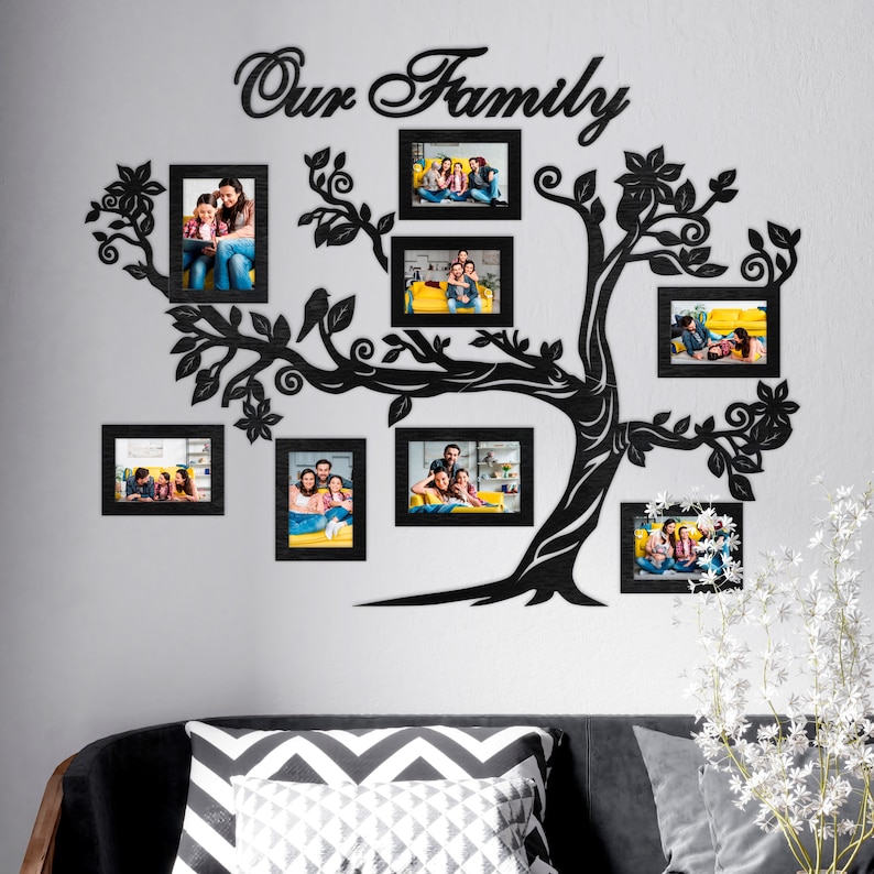 May include: Black silhouette of a family tree with the words "Our Family" at the top. The tree has eight black picture frames with family photos inside. The frames are arranged around the tree branches.