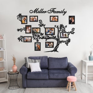 May include: A black metal family tree wall decor with 13 photo frames, featuring the text "Miller Family". The decor is displayed on a white wall above a blue sofa.