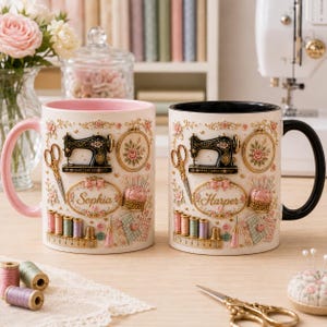 May include: Two ceramic mugs featuring a sewing theme with a black sewing machine, scissors, spools of thread, a pincushion, and a measuring tape. One mug has a pink handle and the name Sophia, while the other has a black handle and the name Harper.