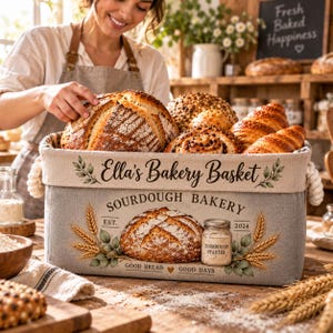May include: A rectangular fabric storage basket with rope handles, featuring the text Ella's Bakery Basket and Sourdough Bakery. The design includes illustrations of a sourdough loaf, a jar labeled Sourdough Starter, and wheat stalks.