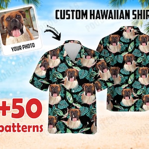 May include: Custom Hawaiian shirt with a tropical leaf pattern and a dog's face repeated throughout the design. The shirt is black with green leaves and the dog's face is brown and white. The text "CUSTOM HAWAIIAN SHIRT" is at the top of the image. The text "YOUR PHOTO" is in a white box with a picture of a dog inside. The text "+50 patterns" is in red at the bottom of the image.