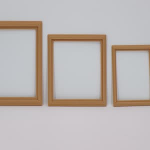 May include: Four brown picture frames of different sizes, arranged in a row from largest to smallest.