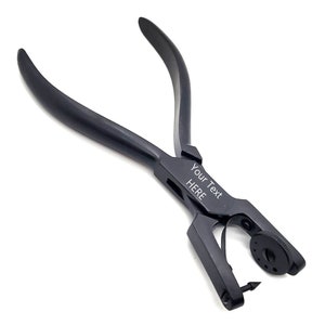 May include: Black metal pliers with a small, round knob and a sharp point. The pliers have a personalized inscription that reads "Your Text HERE".