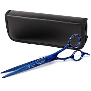 May include: Blue hair cutting shears with a black leather case. The shears have a personalized inscription that reads "Your Name".