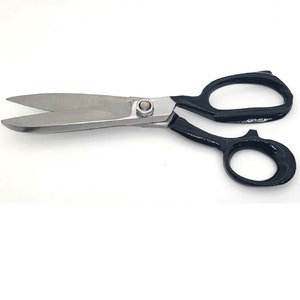 May include: Black handled shears with silver blades. The shears have a small screw in the centre of the blades.