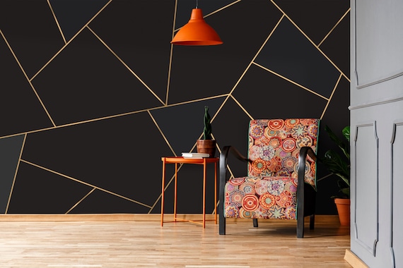 Black wall outlet with gold lines