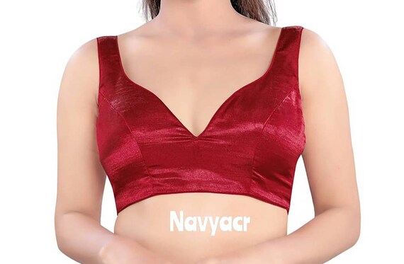 red sleeveless blouse in silk with leaf cut neckline