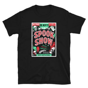 May include: Black t-shirt featuring a vintage-style poster design for a spooky show. The poster is red and green and says "Dr. Neff's Midnite Spook Show" with illustrations of ghosts and monsters.