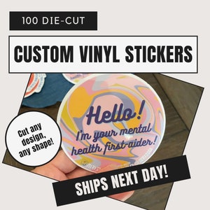 May include: 100 die-cut custom vinyl stickers with a pink, yellow, and blue swirl design. The sticker says "Hello! I'm your mental health first-aider!" in purple text.