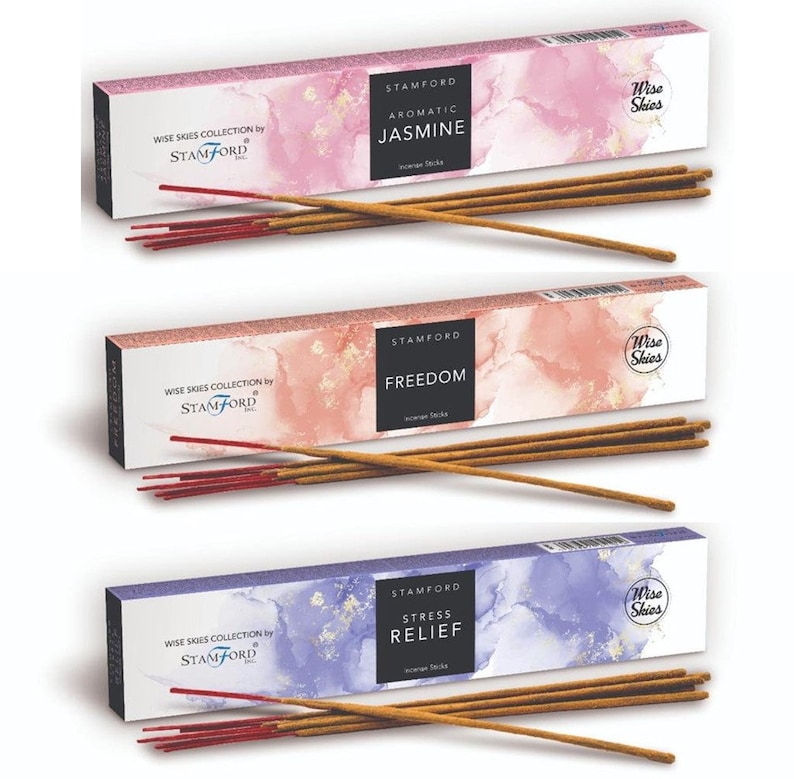 May include: Three boxes of incense sticks with a watercolor background. The boxes are labeled "Wise Skies Collection by Stamford" and feature the scents "Aromatic Jasmine", "Freedom", and "Stress Relief".