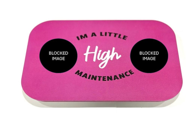 May include: Pink rectangular coaster with the text "I'm a little High Maintenance" in white lettering. The text is surrounded by two black circles with the text "Blocked Image" in white lettering.