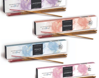 May include: Four boxes of incense sticks with different scents. The boxes are white with watercolor-like designs and the names of the scents are printed on the front. The scents are Lavender Lust, Freedom, Peace and Joy, and Aromatic Jasmine.
