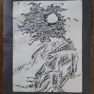 May include: Black and white print of a stylized figure with flowing hair and a textured body. The print is titled "Midra" and signed "Michael Isar Petri 25".