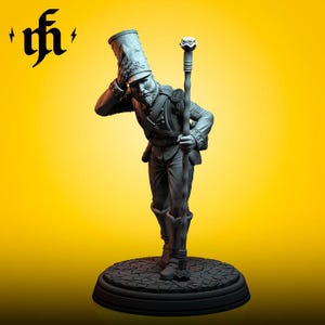 May include: A detailed figurine of a man in a military uniform, holding a staff. The figure is gray and stands on a circular base with a textured surface. The background is a solid yellow. The figure is wearing a tall hat.