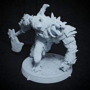 May include: A light gray figurine of a fantasy creature, possibly a monster or warrior, holding an axe. The figure has a reptilian appearance with scales, spikes, and armor. It stands on a circular base.