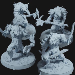 May include: Four light gray fantasy miniatures of reptilian creatures in various action poses. Each figure is armed with weapons such as swords, axes, and claws. The figures are on circular bases, suggesting a tabletop game or collectible.
