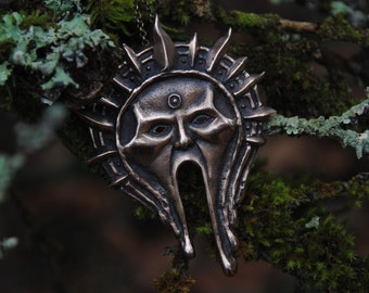 Large bronze sun god pendant