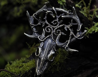 Large solid brass deer skull pendant with a triskelion, symbol of renewal