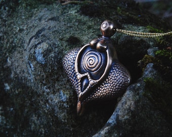 "Sheela Na Gig" bronze pendant.