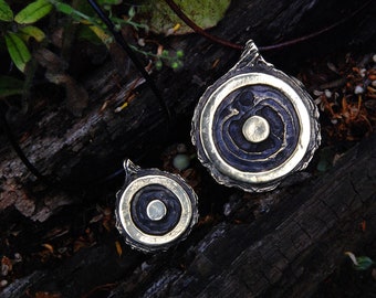Solstice pendant, solar symbol in brass