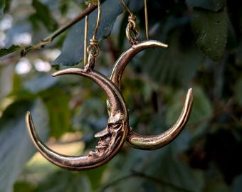 Brass crescent moon face earrings
