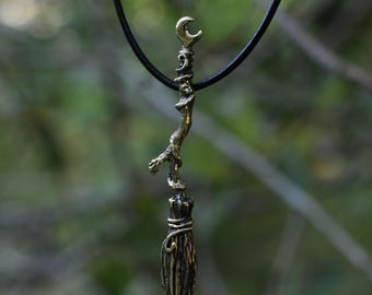 Brass witch's broom pendant
