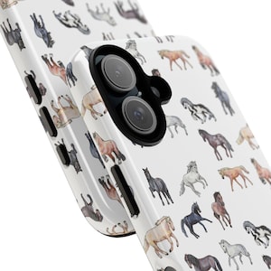 May include: White phone case with a repeating pattern of watercolour-style horses in various colours. The horses are shown in different poses, creating a dynamic design. The case has a glossy finish and a camera cutout.