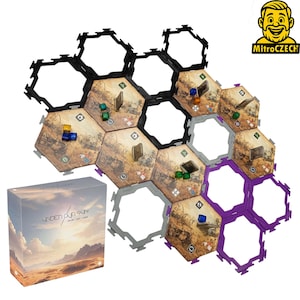 May include: A board game titled "Under Our Sun" with hexagonal game tiles and a box featuring a landscape image. The game tiles are brown with desert-like illustrations, and the borders are black, gray, and purple. Small game pieces are scattered across the tiles.